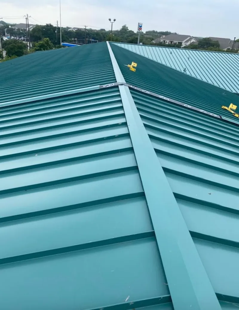 Green commercial metal roof ridge and valley for Metal Roof Repair in Waterboro
